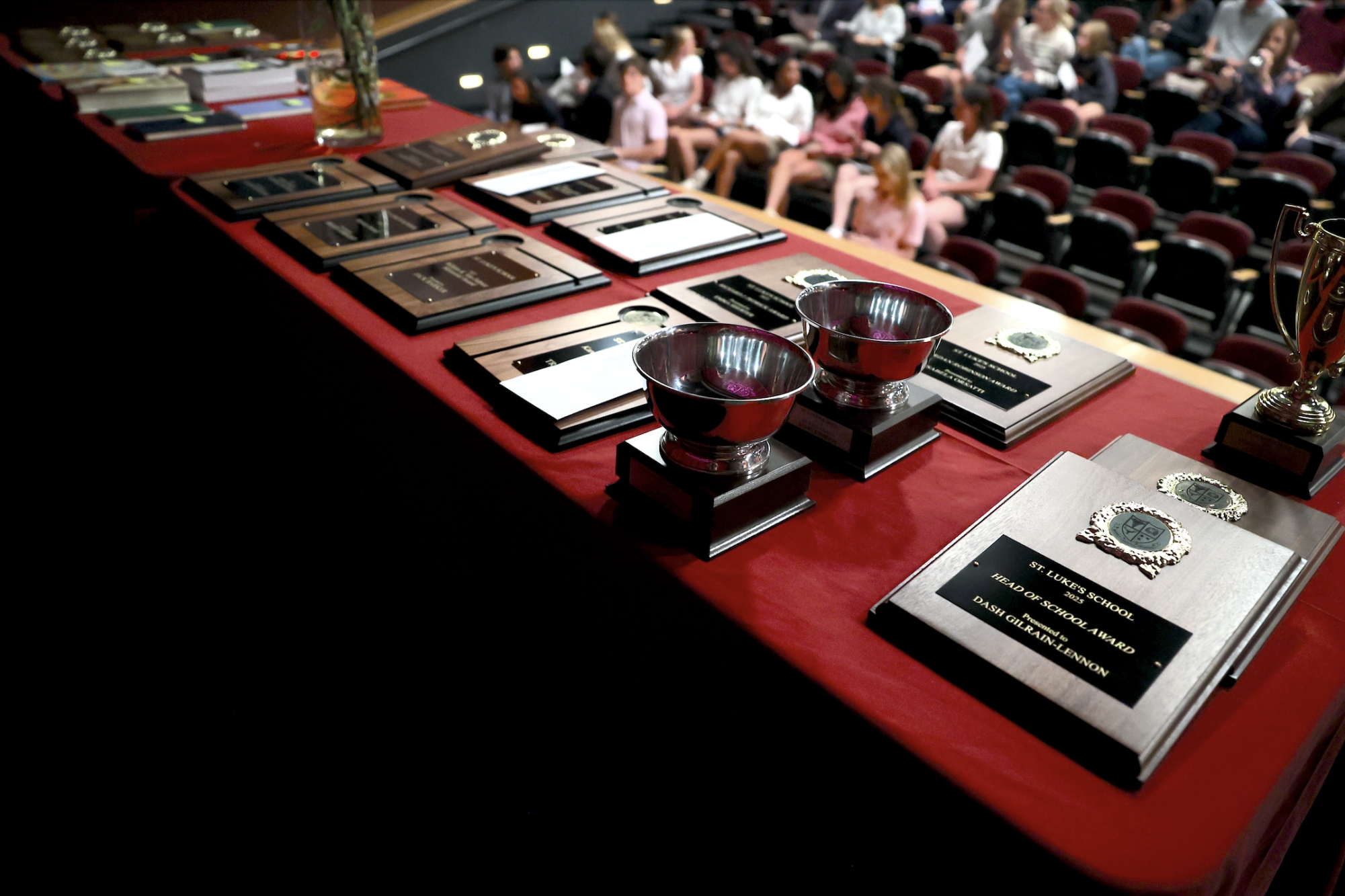 Awards presented at the Upper School Awards Night laid on the table before the start of the ceremony. 
